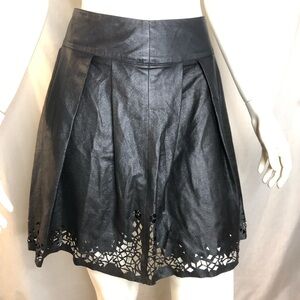 Woman’s black faux leather fit and flare skirt with cut out design size small